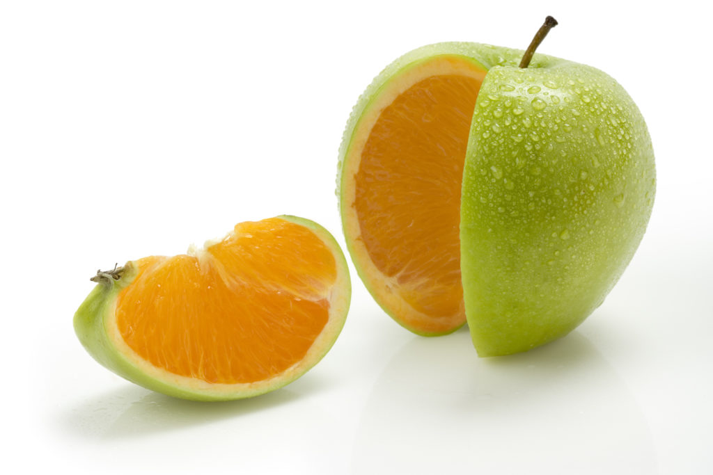 A slice of apple with an orange inside